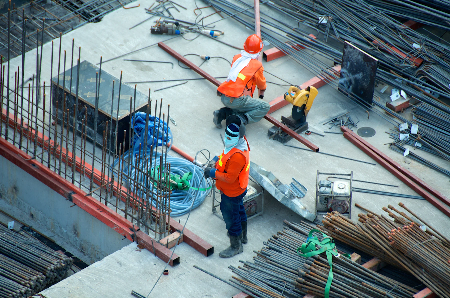 Construction professional coordinating work on an active building site